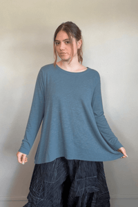 North Star Base by gertie 1153 Long Angle Tee, a relaxed long-sleeve A-line slub-knit top with a wide round neckline and flowing hem, shown in Mustard, Black, and Dusty Denim.