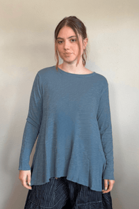North Star Base by gertie 1153 Long Angle Tee, a relaxed long-sleeve A-line slub-knit top with a wide round neckline and flowing hem, shown in Mustard, Black, and Dusty Denim.