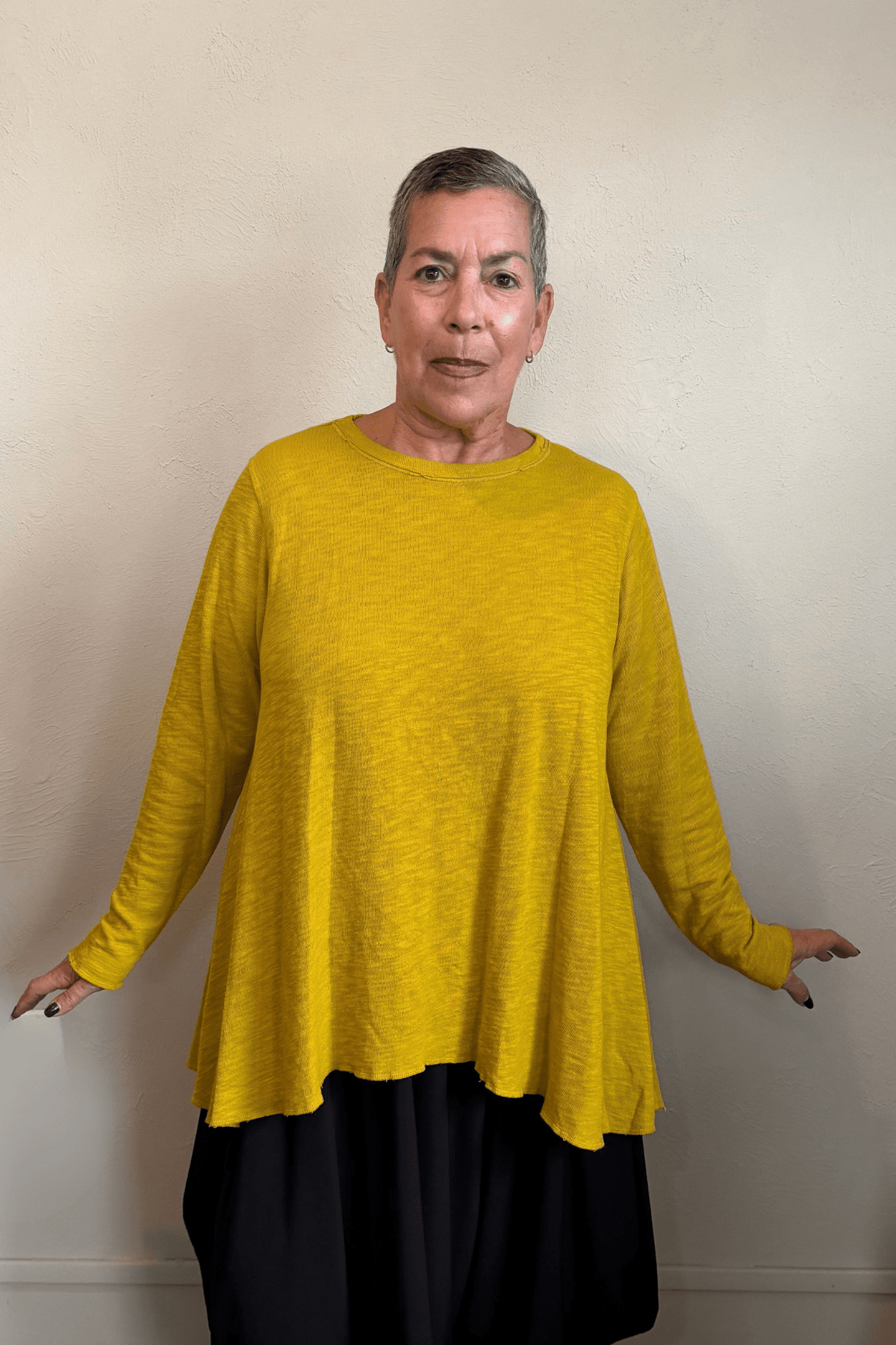 North Star Base by gertie 1153 Long Angle Tee, a relaxed long-sleeve A-line slub-knit top with a wide round neckline and flowing hem, shown in Mustard, Black, and Dusty Denim.