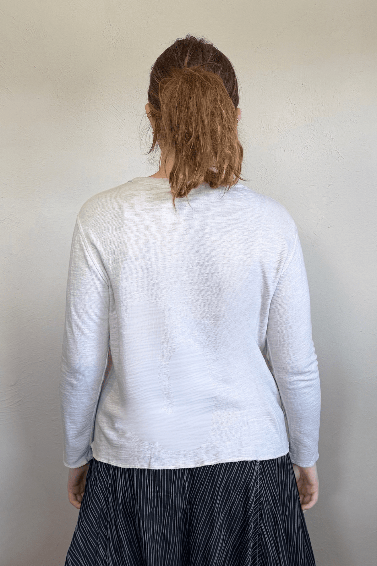 North Star Base by gertie 1547 Tee Shirt, a relaxed waist-length long-sleeve slub-knit tee with a round crew neckline, shown in Nimbus and Mustard.