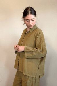 Gertie's 2167 Corduroy Big Shirt, an oversized fine-wale corduroy button-front shirt with point collar, dropped shoulders, wide three-quarter sleeves, side slits, and a longer back hem, shown in black and olive.