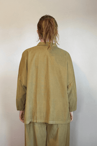 Gertie's 2167 Corduroy Big Shirt, an oversized fine-wale corduroy button-front shirt with point collar, dropped shoulders, wide three-quarter sleeves, side slits, and a longer back hem, shown in black and olive.