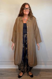 Gertie's 3095 Travel Duster in Winter Olive and Indigo, featuring a long relaxed silhouette, point collar, button front, three-quarter sleeves, crinkled texture, pockets and rounded hem.