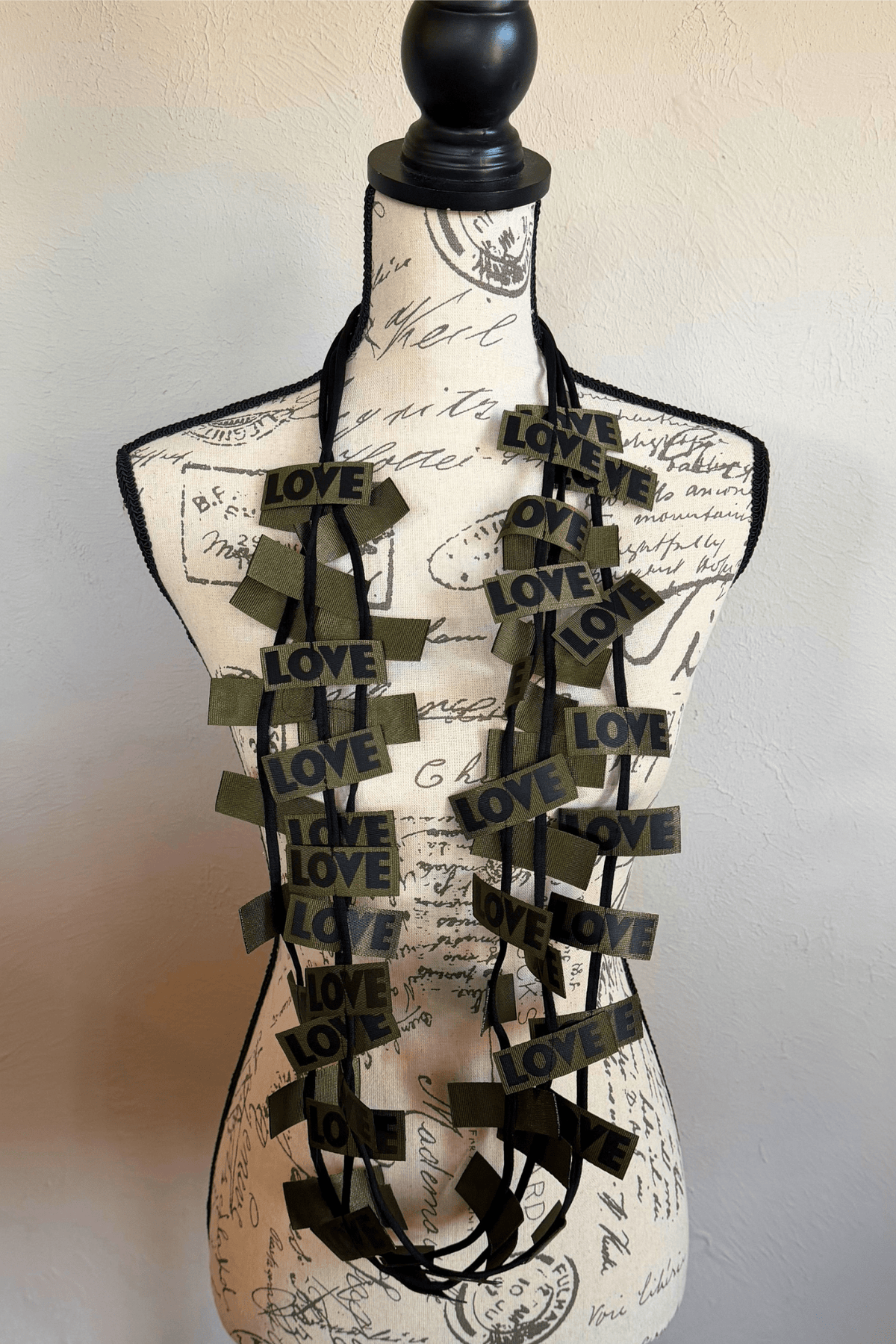 Jianhui 3 Strand Love Ribbon Necklace shown in Charcoal and Olive, styled long and doubled