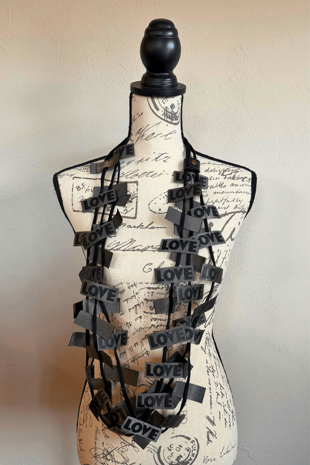 Jianhui 3 Strand Love Ribbon Necklace shown in Charcoal and Olive, styled long and doubled