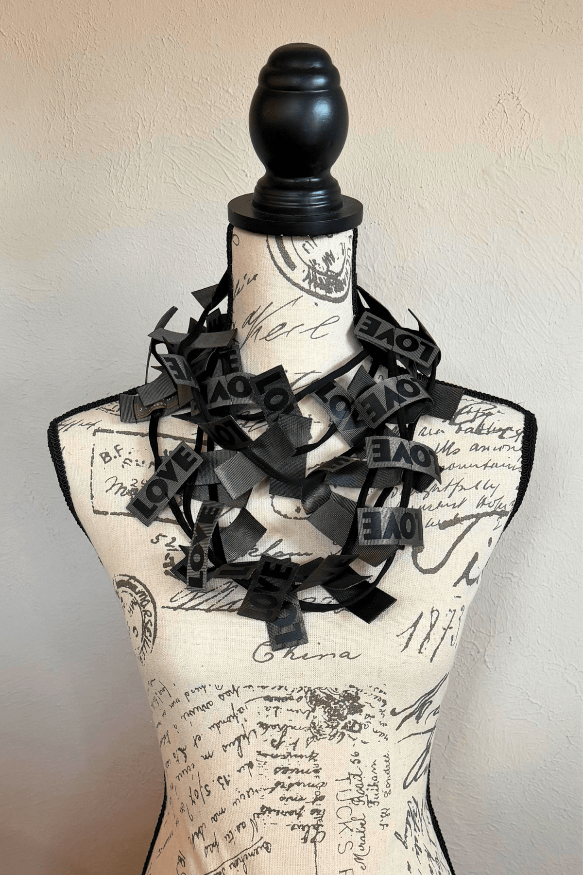 Jianhui 3 Strand Love Ribbon Necklace shown in Charcoal and Olive, styled long and doubled
