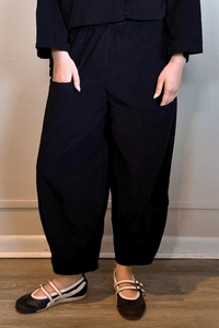 Gertie's 5079 3 Pocket Corduroy Pant, a cropped fine-wale corduroy pull-on barrel-leg pant with oversized patch pockets and an asymmetrical lower-leg pocket, shown in black and olive.