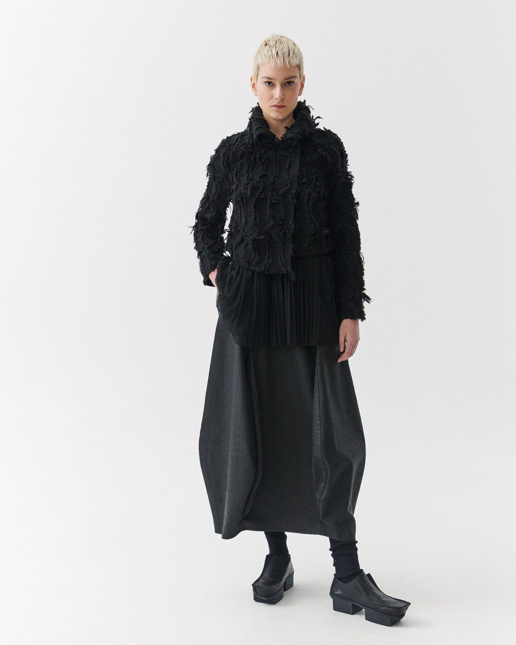 Kedziorek 5311 charcoal black coated cotton cocoon midi skirt, front and side views showing sculptural panels