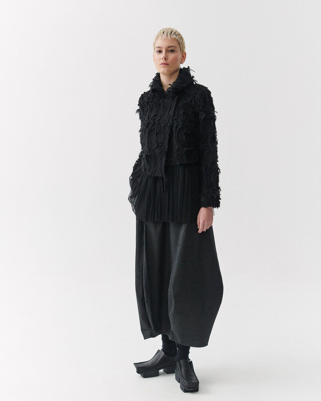 Kedziorek 5311 charcoal black coated cotton cocoon midi skirt, front and side views showing sculptural panels