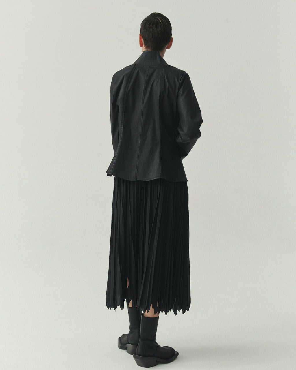 Kedziorek 5513 black waxed cotton jacket with stand collar, zip front, asymmetrical pocket and architectural seaming