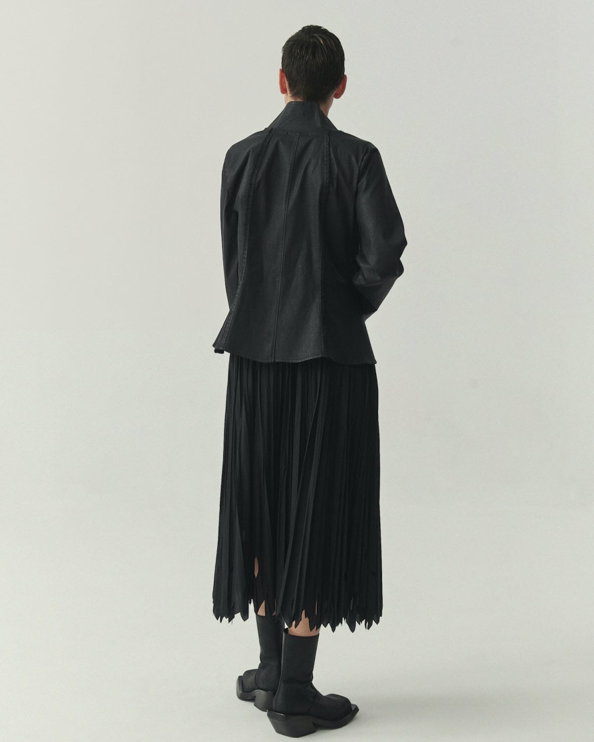 Kedziorek 5513 black waxed cotton jacket with stand collar, zip front, asymmetrical pocket and architectural seaming