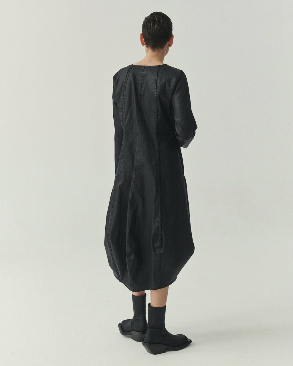 Kedziorek 5517 black waxed cotton midi cocoon dress, front side and back views with architectural seaming