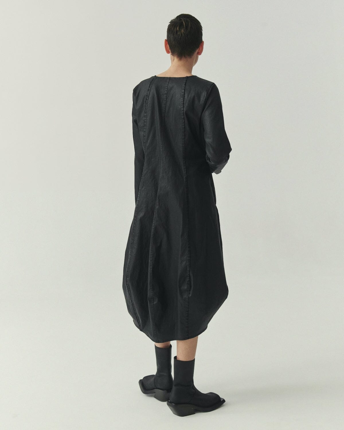 Kedziorek 5517 black waxed cotton midi cocoon dress, front side and back views with architectural seaming