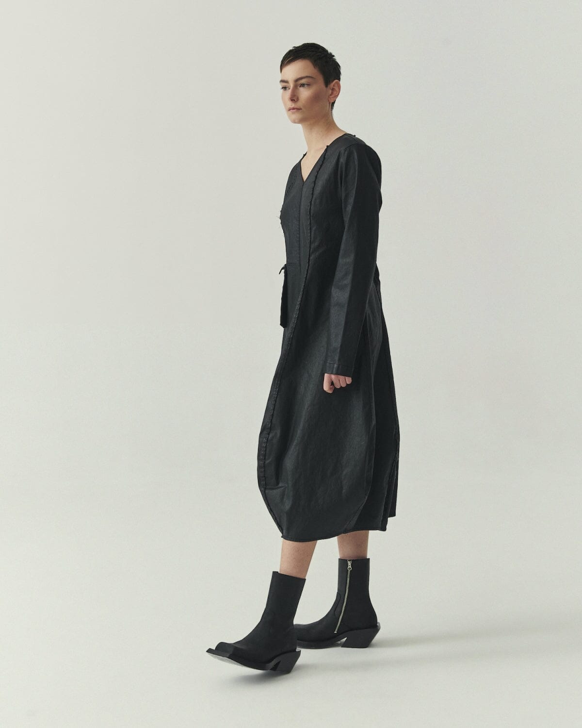Kedziorek 5517 black waxed cotton midi cocoon dress, front side and back views with architectural seaming