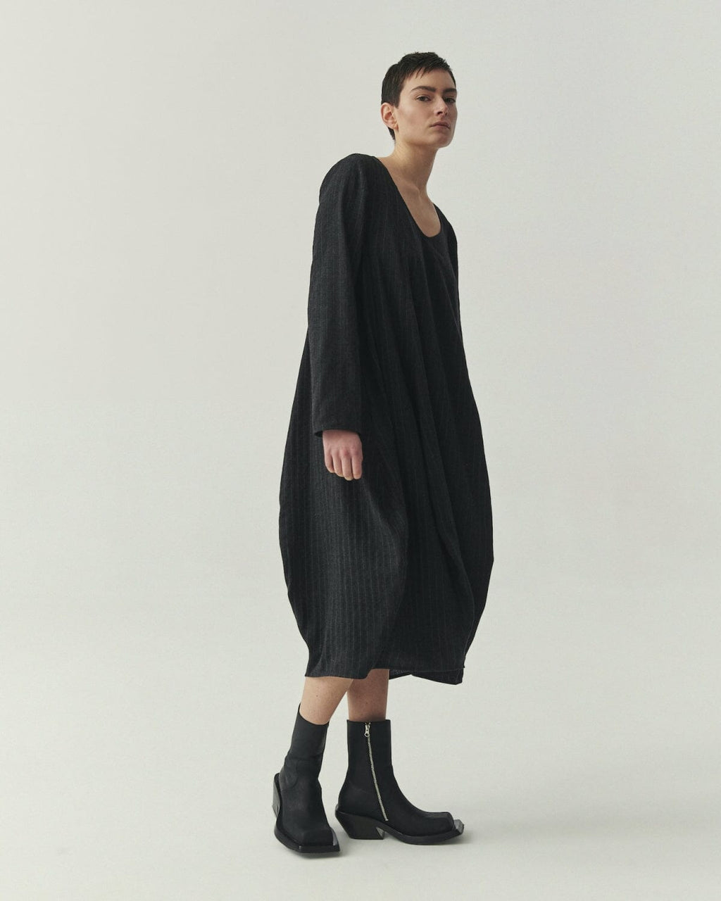 Kedziorek 5527 charcoal and black pinstripe cocoon midi dress with asymmetrical panels and patch pocket
