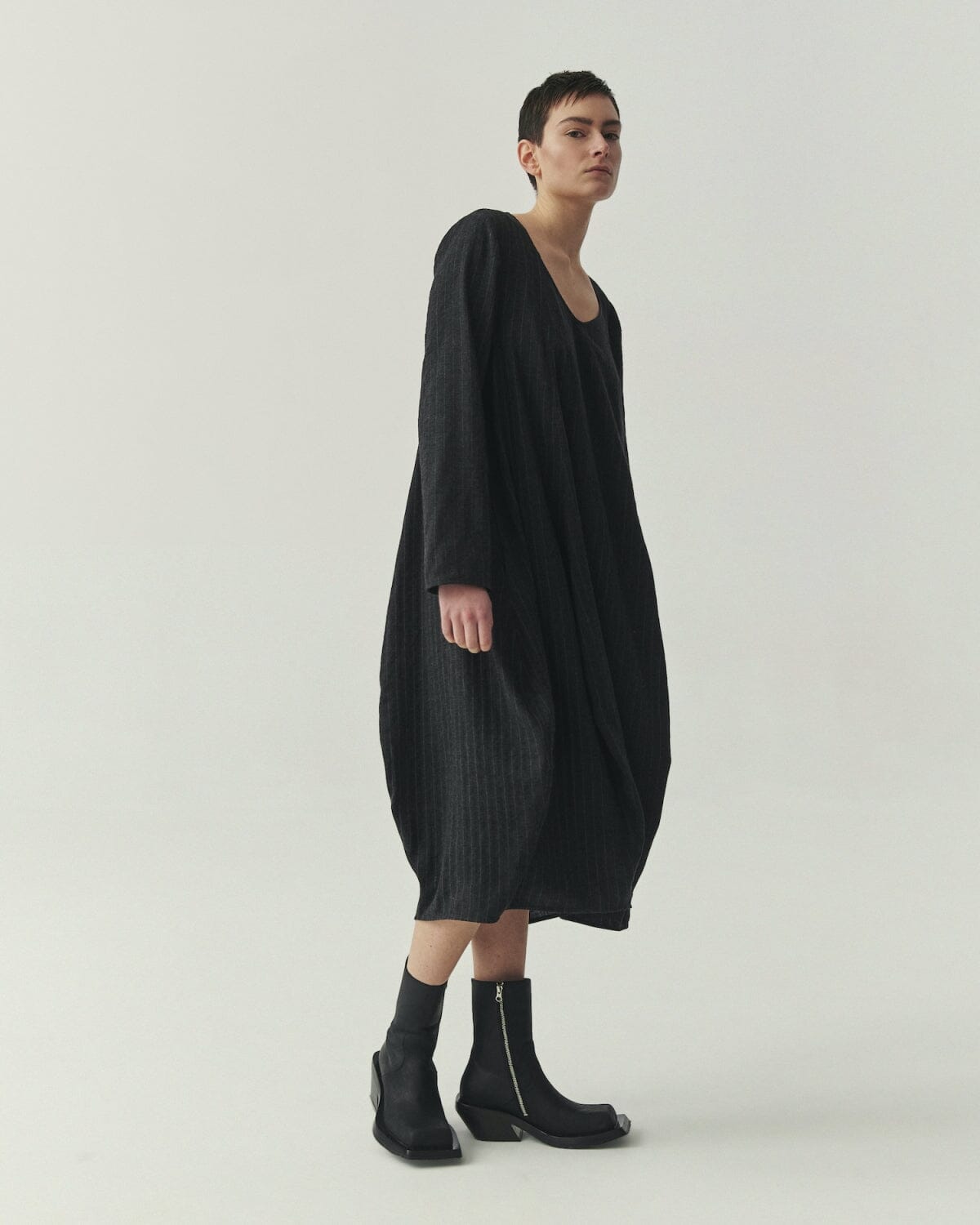 Kedziorek 5527 charcoal and black pinstripe cocoon midi dress with asymmetrical panels and patch pocket