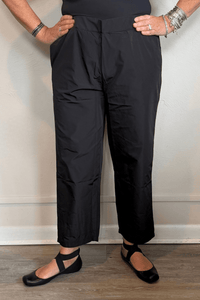 Kozan Alabama black pull-on pants with a flat front waistband, gathered elastic back, side pockets, and a relaxed straight cropped leg.