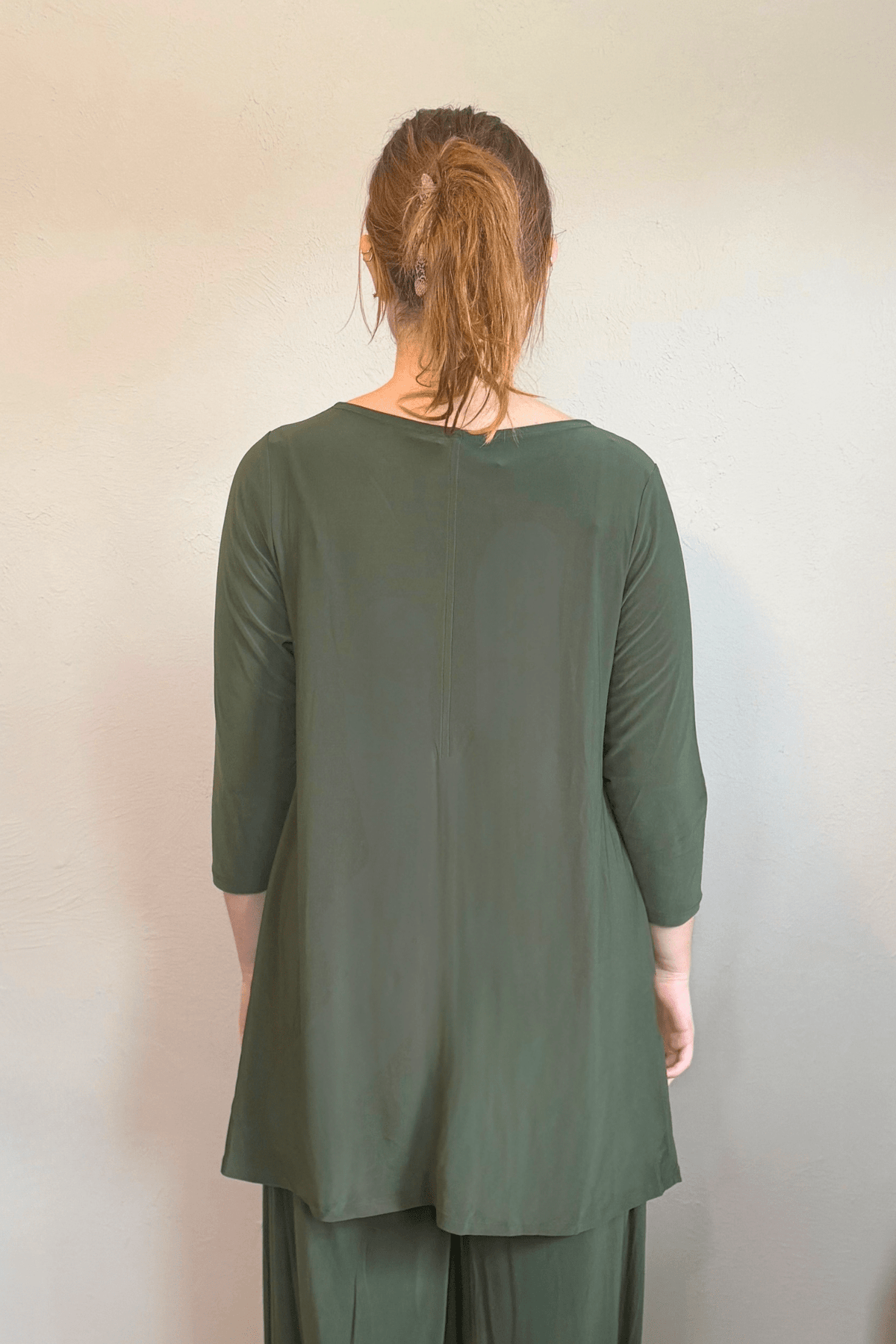 Kozan Dima Tunic in Thyme, a relaxed A-line tunic with three-quarter sleeves and a high-low hem.