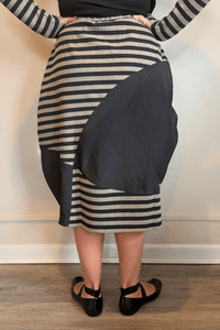 Kozan Fischer midi skirt with horizontal stripes, a full rounded silhouette, and asymmetrical solid contrast panels.