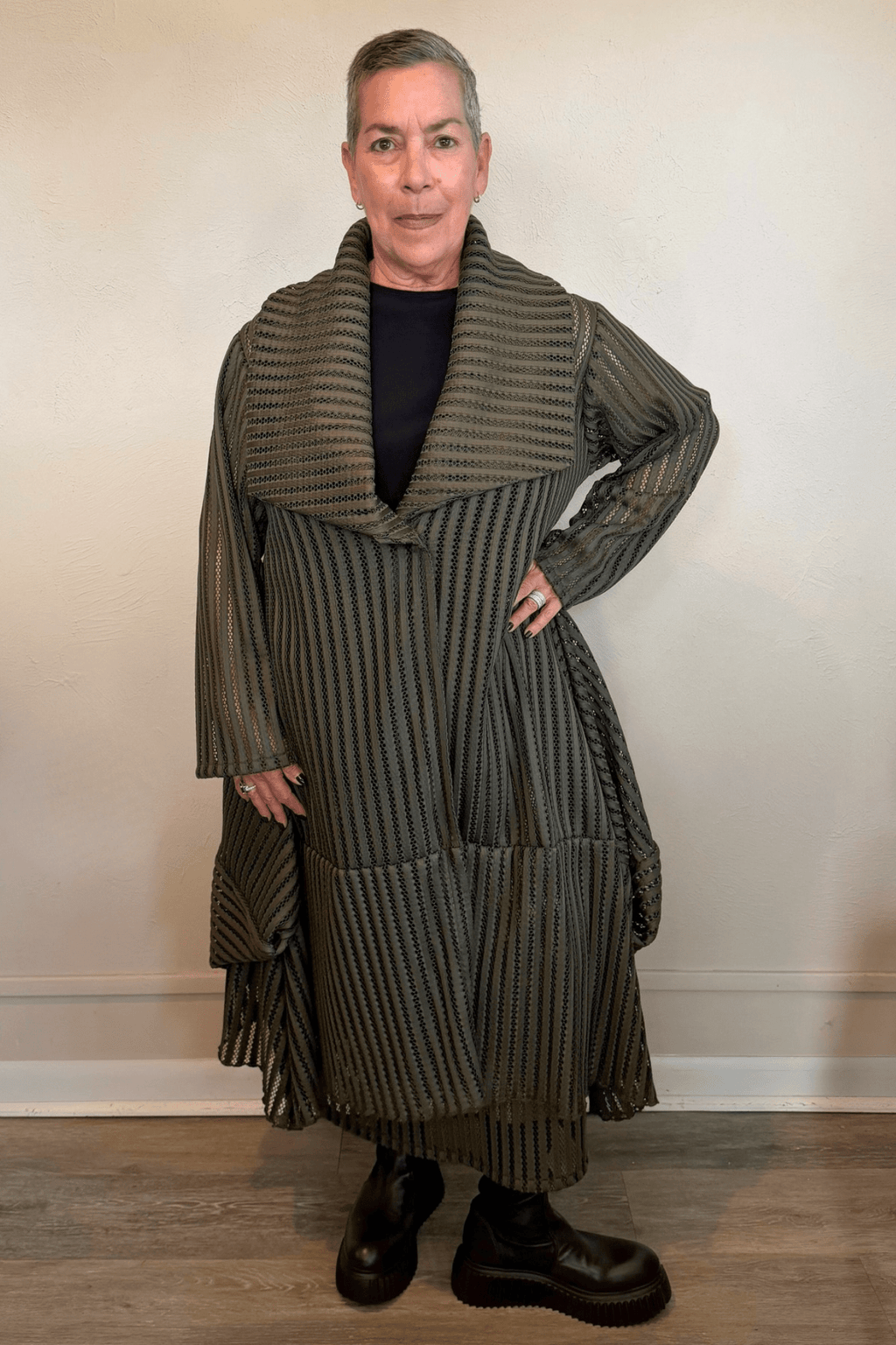 Heydari HOJ olive green sheer openwork mesh long jacket with oversized collar and asymmetrical silhouette
