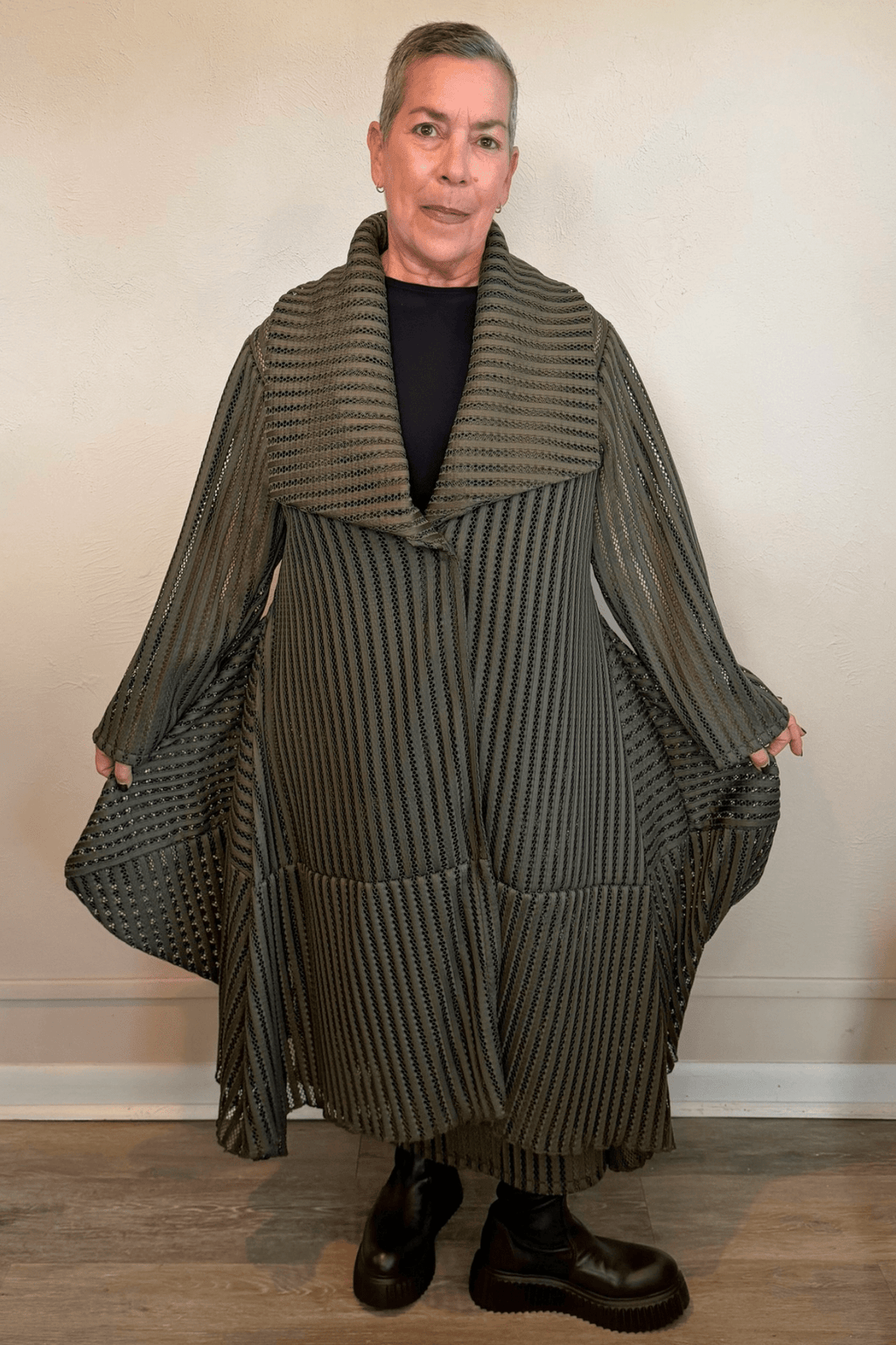 Heydari HOJ olive green sheer openwork mesh long jacket with oversized collar and asymmetrical silhouette