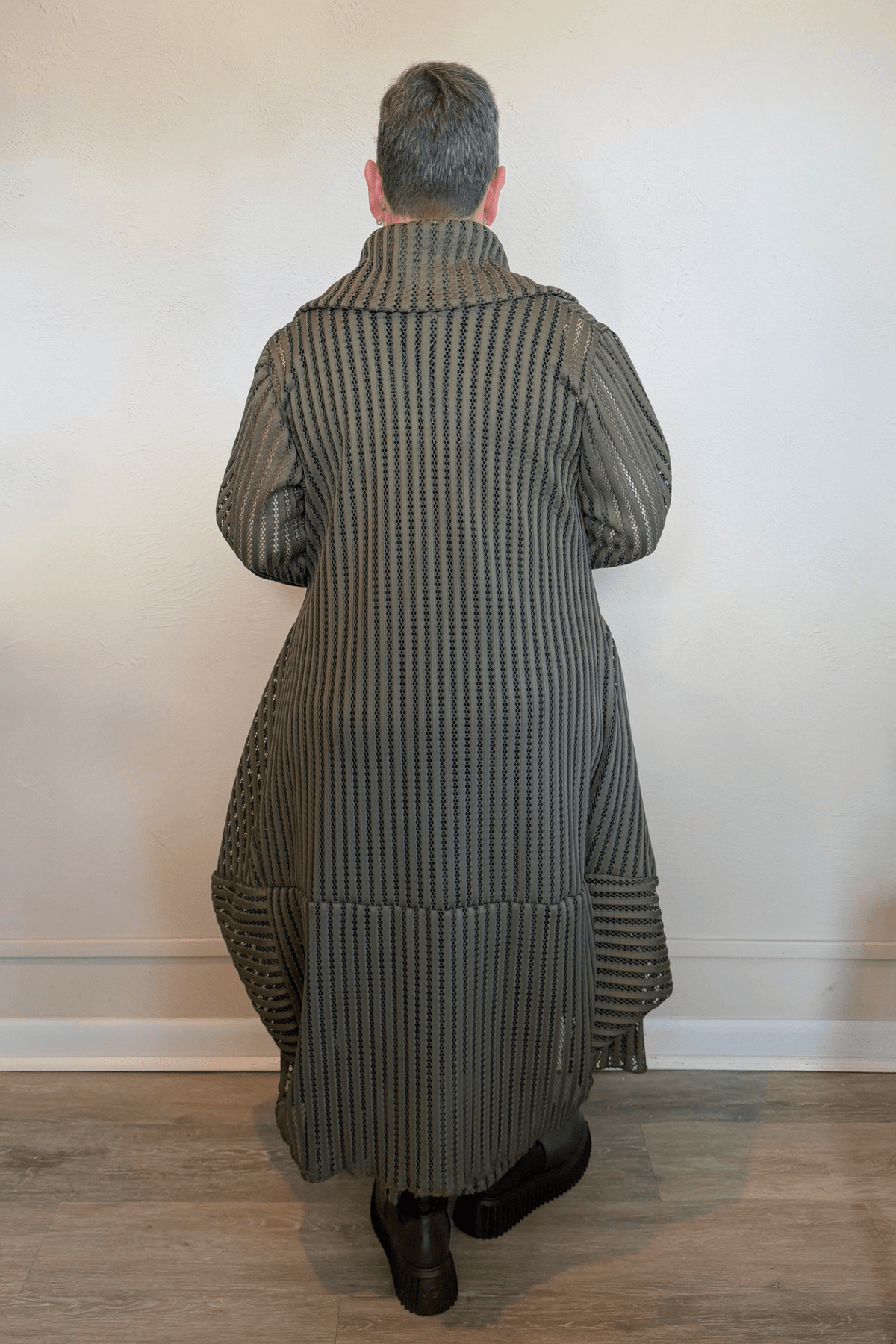 Heydari HOJ olive green sheer openwork mesh long jacket with oversized collar and asymmetrical silhouette