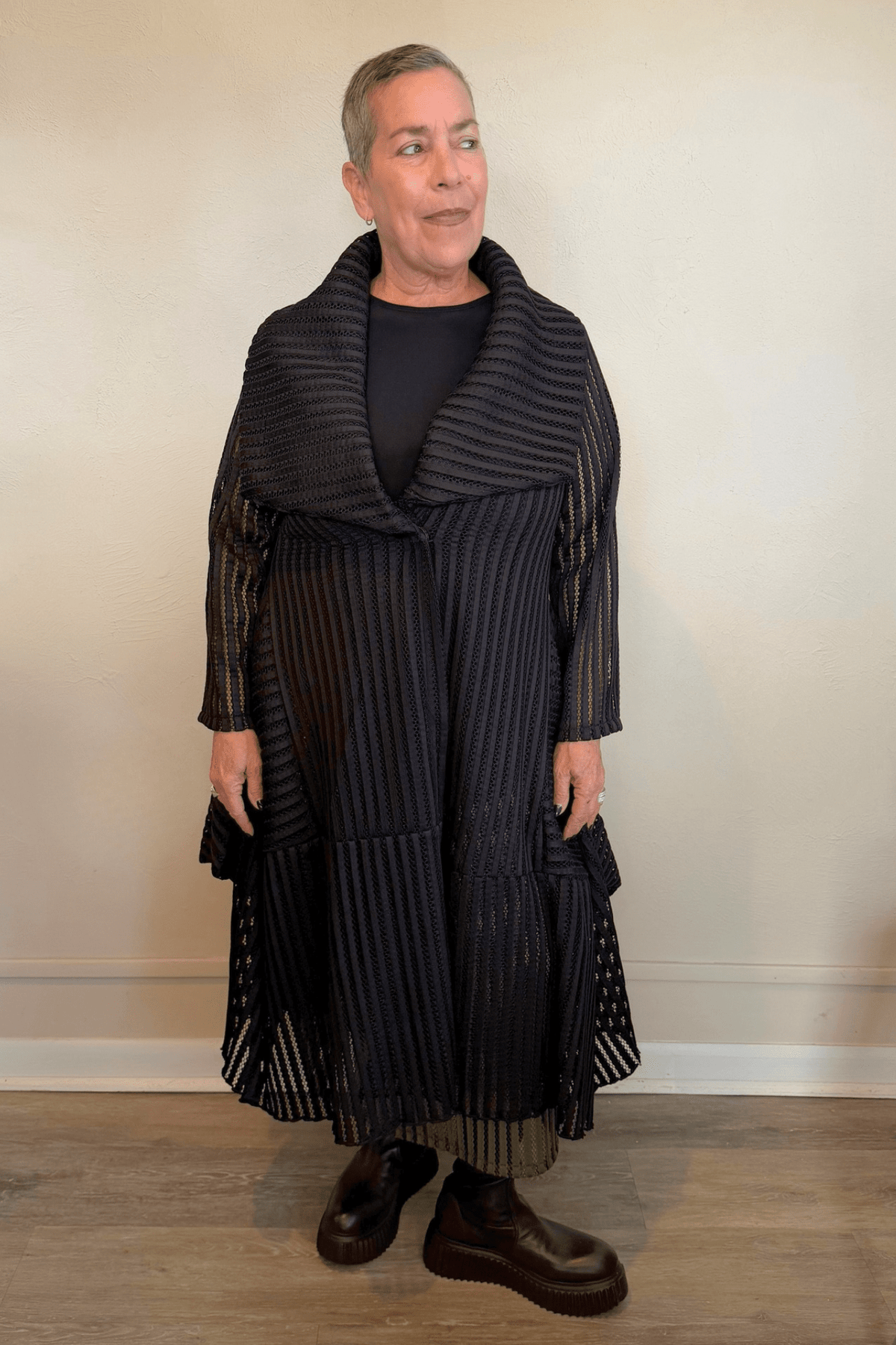 Heydari HOJ black textured openwork mesh jacket with oversized collar and sculptural asymmetrical hem