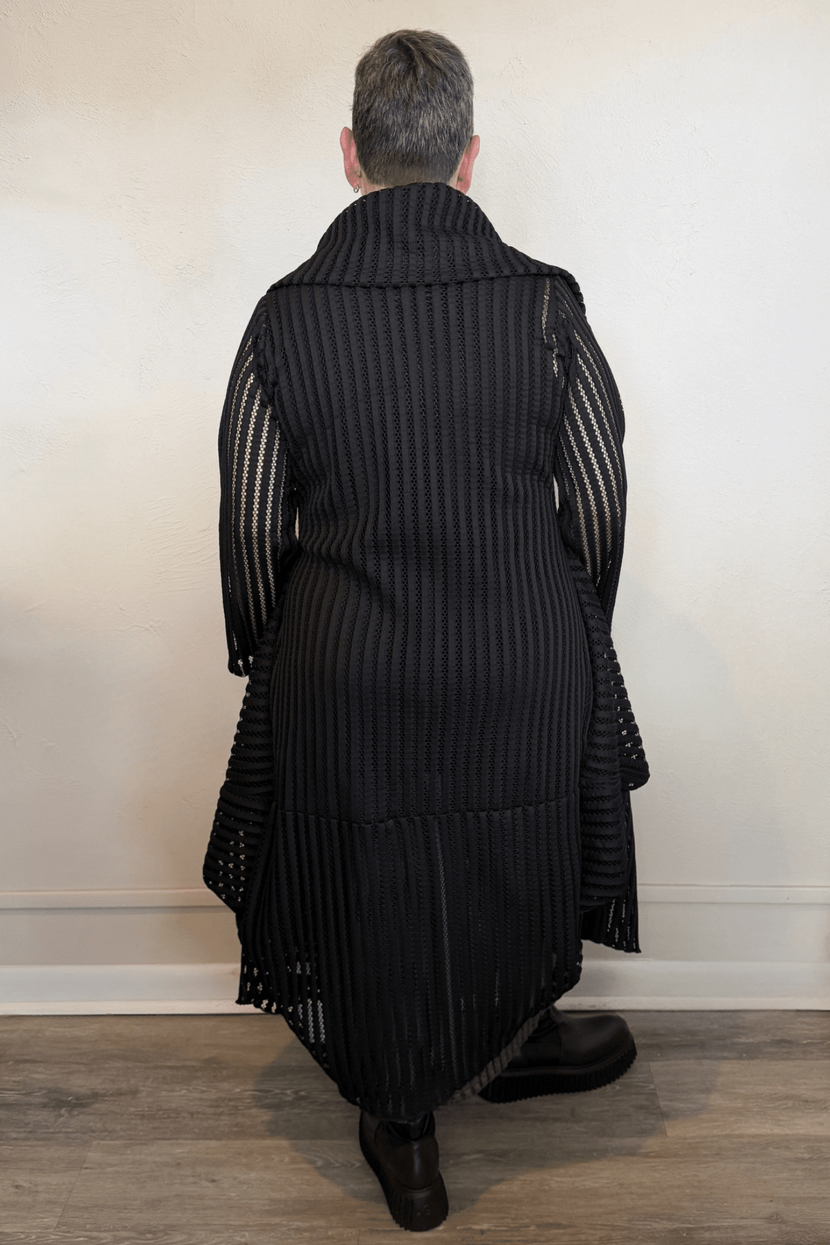 Heydari HOJ black textured openwork mesh jacket with oversized collar and sculptural asymmetrical hem