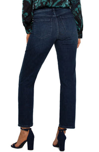 Dark indigo slim-straight jeans in the Warner Lake wash with a mid-rise waist, belt loops, five-pocket styling, zip fly with logo button closure, subtle fading, and a cropped ankle-length silhouette.