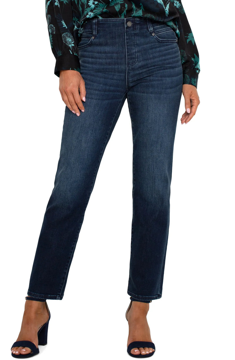 Dark indigo slim-straight jeans in the Warner Lake wash with a mid-rise waist, belt loops, five-pocket styling, zip fly with logo button closure, subtle fading, and a cropped ankle-length silhouette.