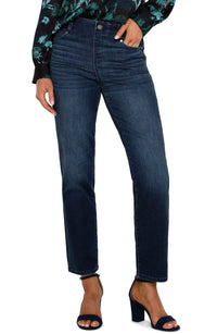 Dark indigo slim-straight jeans in the Warner Lake wash with a mid-rise waist, belt loops, five-pocket styling, zip fly with logo button closure, subtle fading, and a cropped ankle-length silhouette.