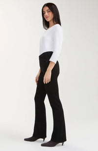 Black rinse baby boot jeans with a mid-rise waist, belt loops, five-pocket styling, zip fly with logo button closure, fitted hip and thigh, and a subtle full-length bootcut leg.