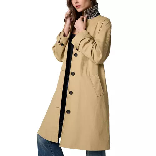 Tan raglan-sleeve coat with a straight relaxed silhouette, front button closure, angled welt pockets, long sleeves with button-tab cuffs, contrast houndstooth stand collar, and a center back inverted pleat with buttoned tab detail.