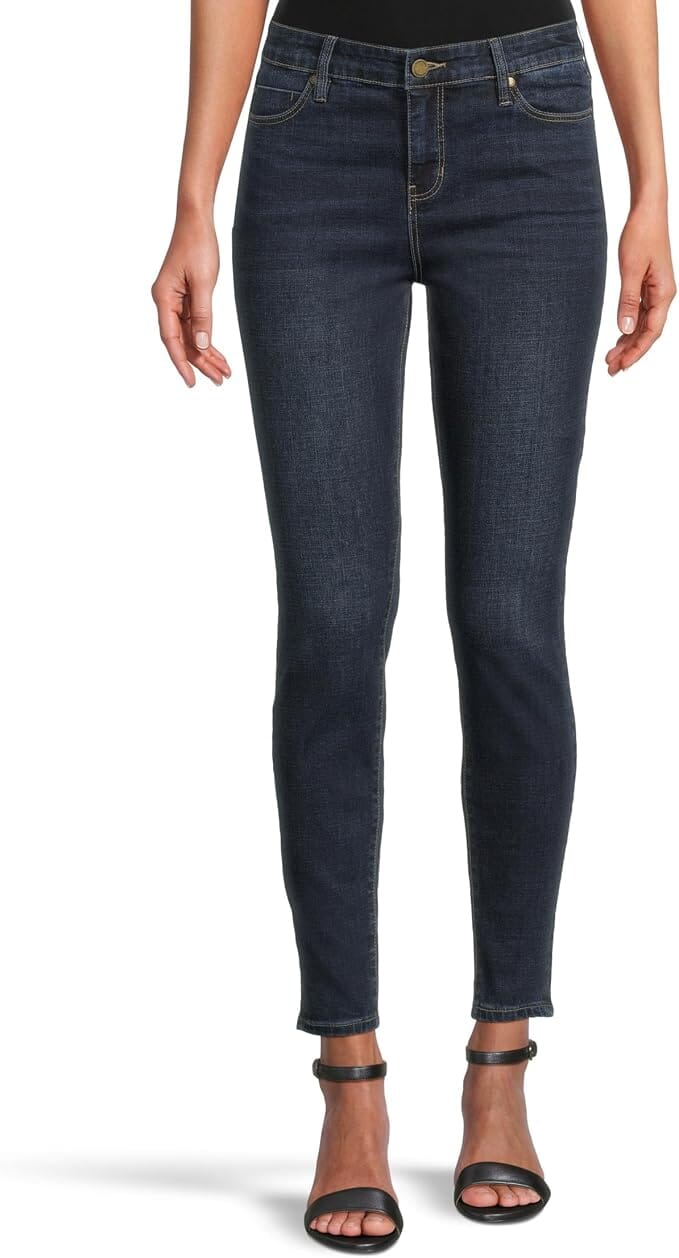 Dark indigo ankle-length skinny jeans with a mid-rise waist, belt loops, five-pocket styling, zip fly with button closure, subtle fading, and a slim streamlined leg.