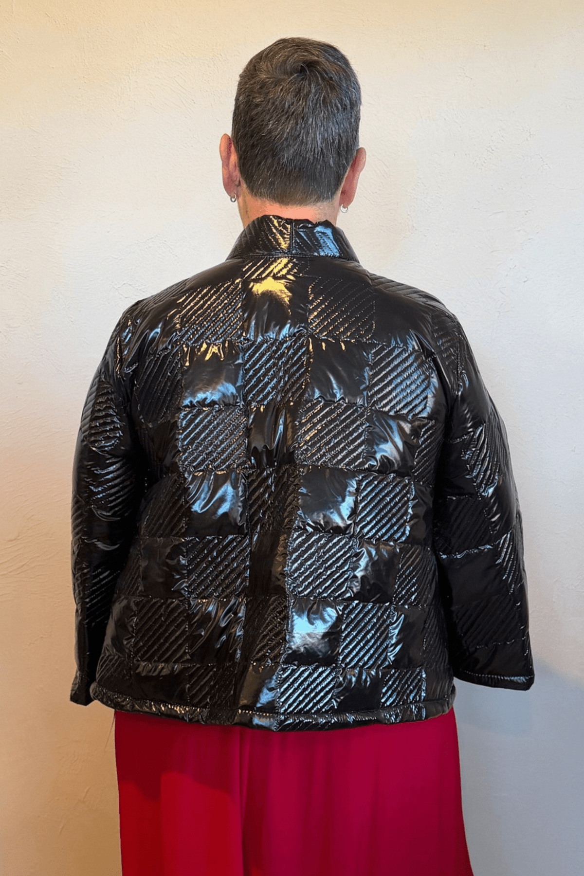 Heydari NOJS reversible short quilted jacket in multicolor abstract print and glossy black checkerboard