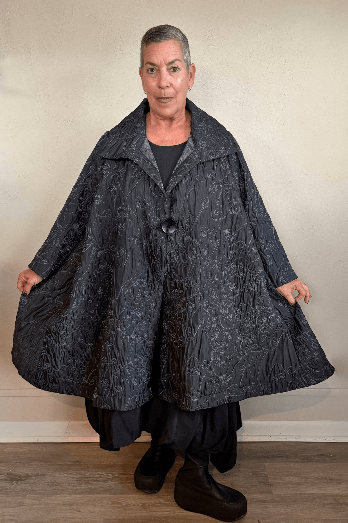 Heydari NOJ5 Face Jacket in charcoal with contrasting embroidered abstract faces, front, side and back views