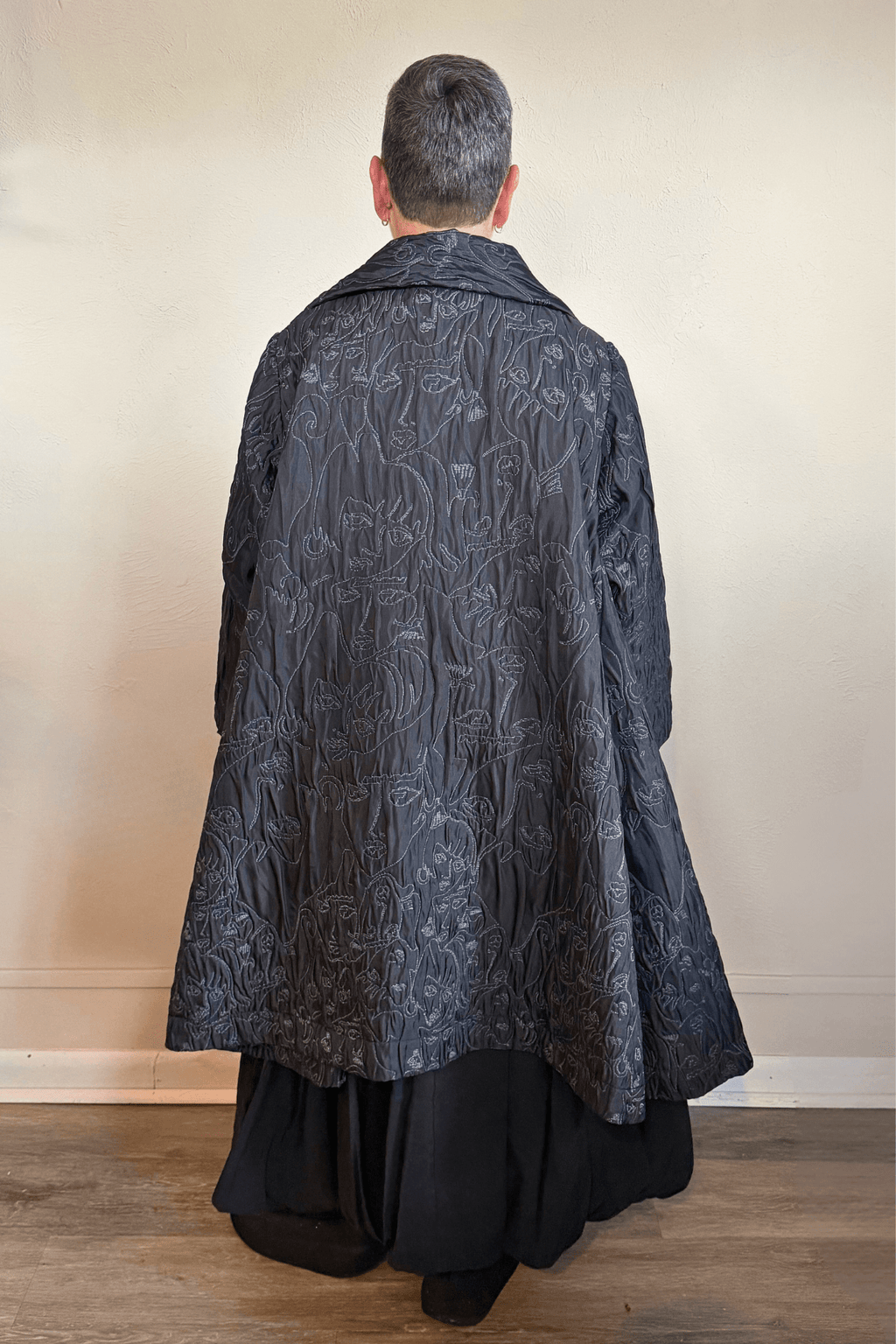 Heydari NOJ5 Face Jacket in charcoal with contrasting embroidered abstract faces, front, side and back views