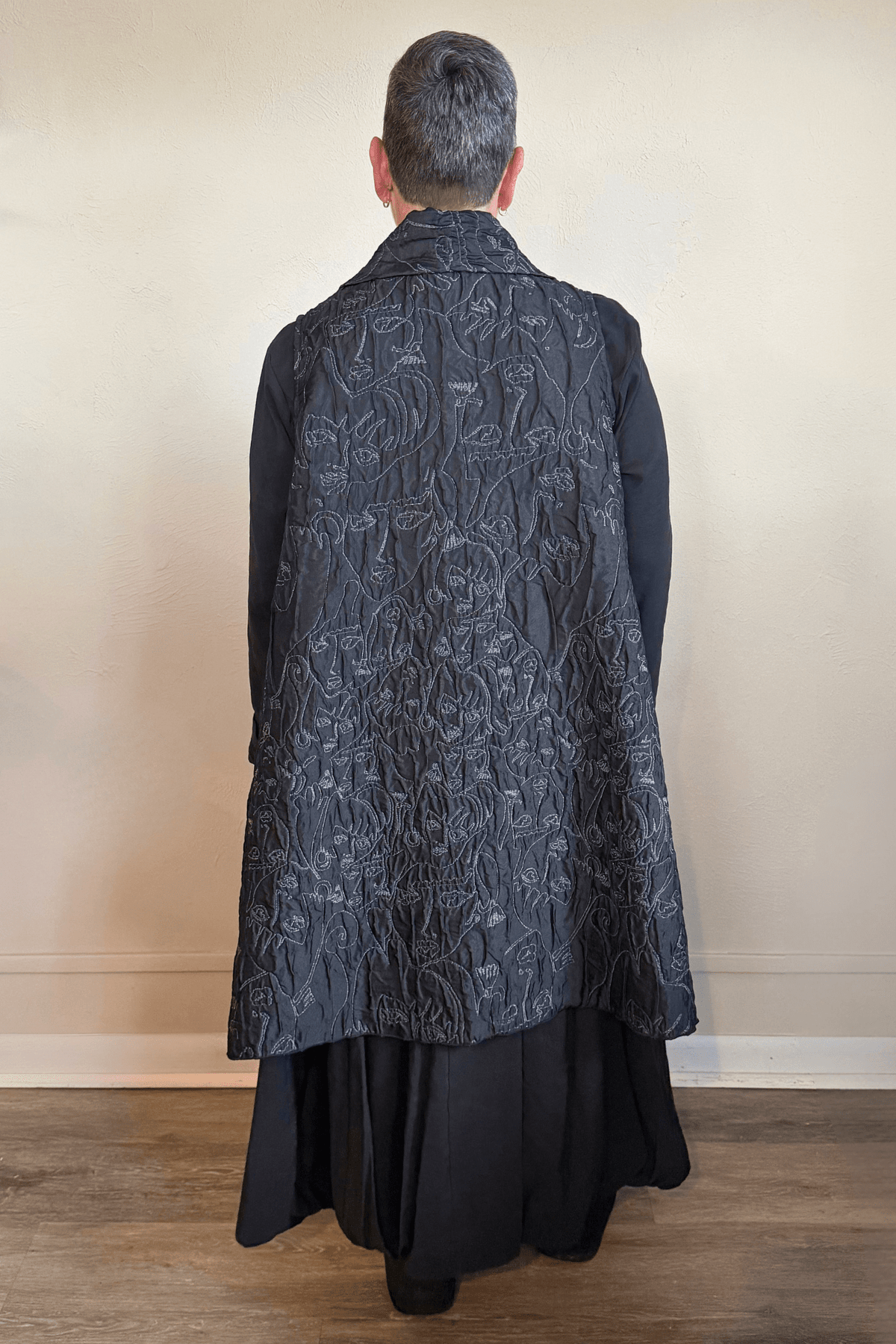 Heydari NOVNEW Face Vest in charcoal with embroidered abstract faces, front and back views