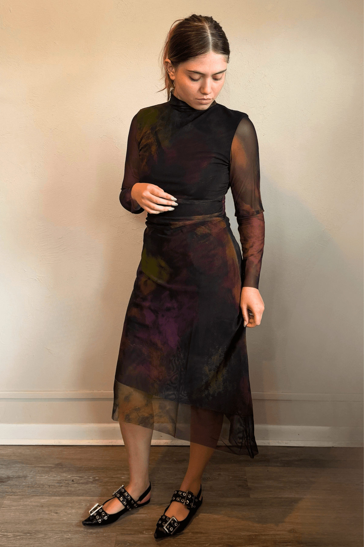 Kozan SH-11058 Mack Dress in Loden, shown from front and back with abstract painterly print, sheer long sleeves, high neckline, and layered asymmetrical midi hem.