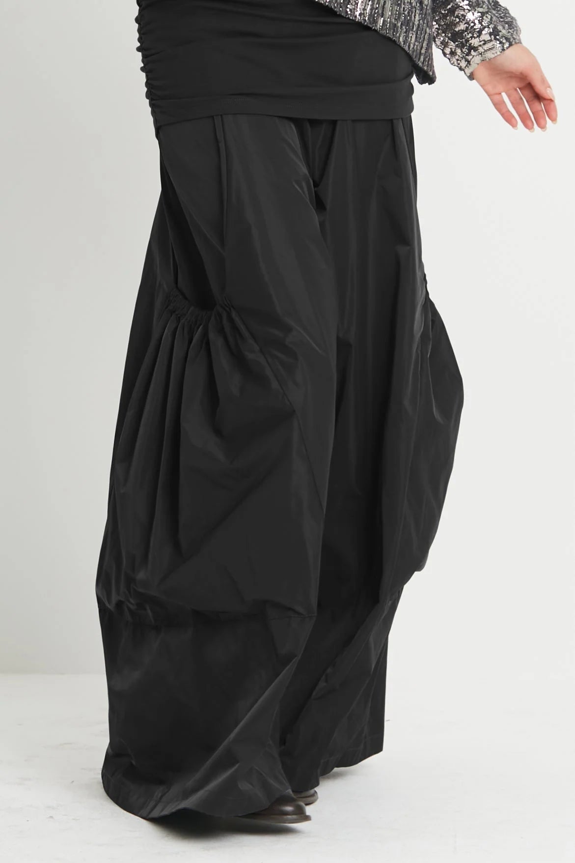 Planet Big Pocket Pant in black showing voluminous wide-leg silhouette and gathered statement pockets
