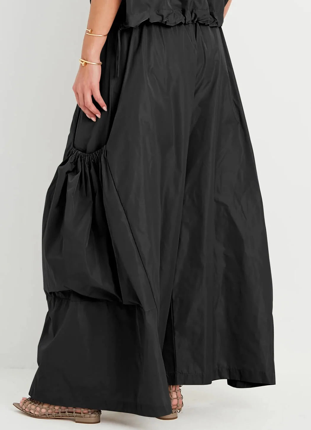 Planet Big Pocket Pant in black showing voluminous wide-leg silhouette and gathered statement pockets