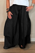 Planet Big Pocket Pant in black showing voluminous wide-leg silhouette and gathered statement pockets