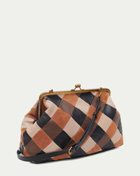 American Leather Co. Grace Oversized Clutch with woven leather patchwork, vintage-inspired kisslock frame, and removable crossbody strap.