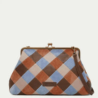 American Leather Co. Grace Oversized Clutch with woven leather patchwork, vintage-inspired kisslock frame, and removable crossbody strap.
