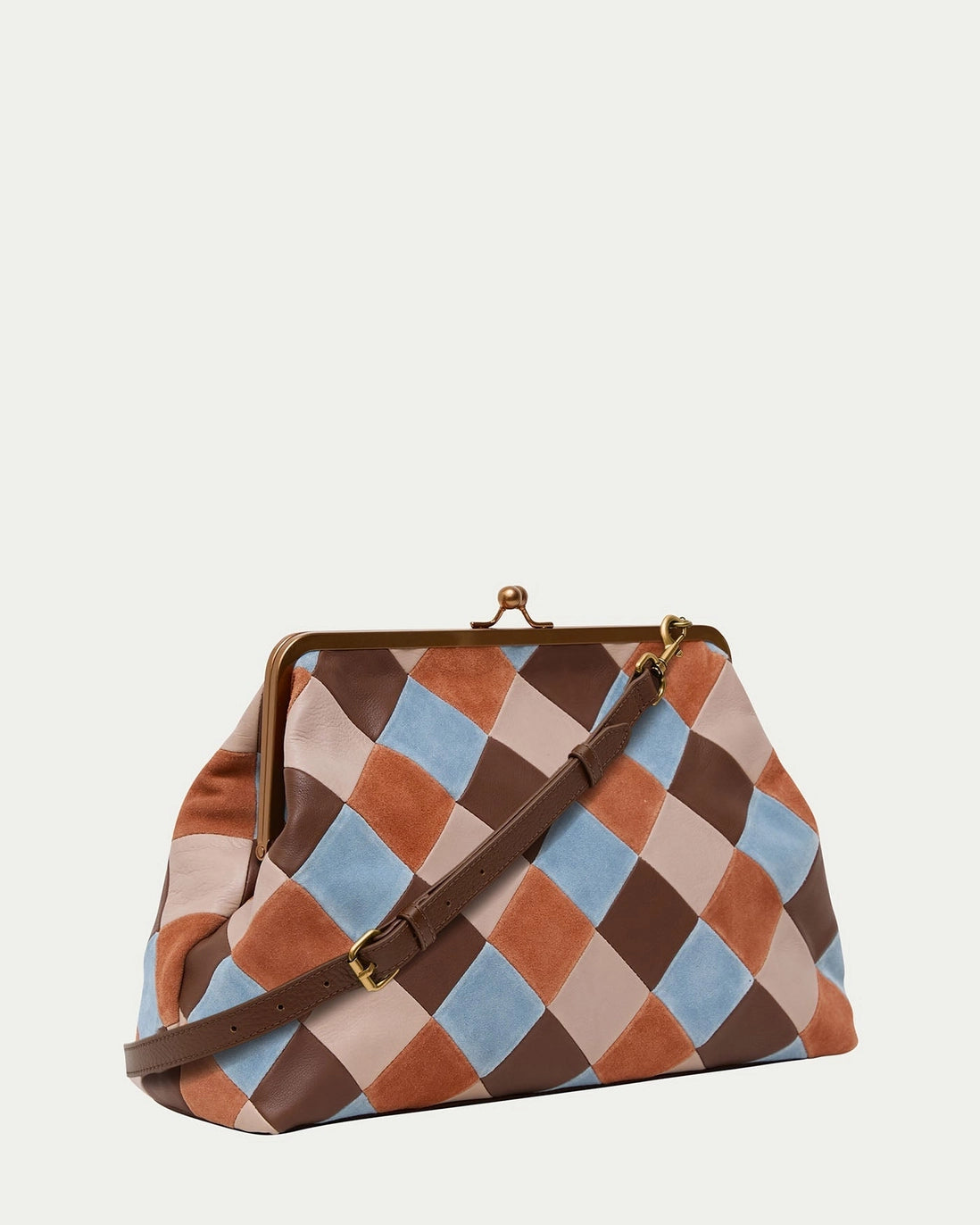 American Leather Co. Grace Oversized Clutch with woven leather patchwork, vintage-inspired kisslock frame, and removable crossbody strap.