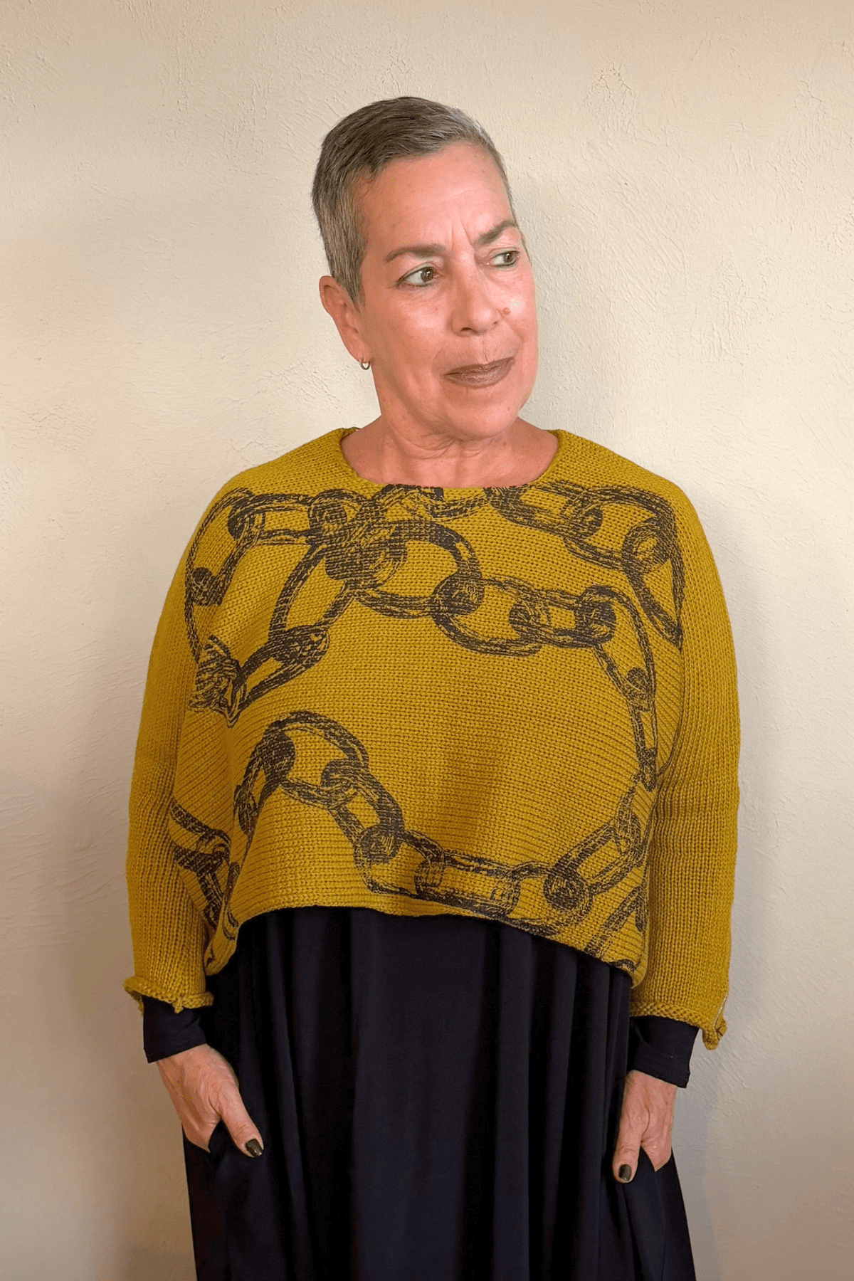 Paper Temples Heather Chain Pullover Sweater in mustard with charcoal chain print, front and back views