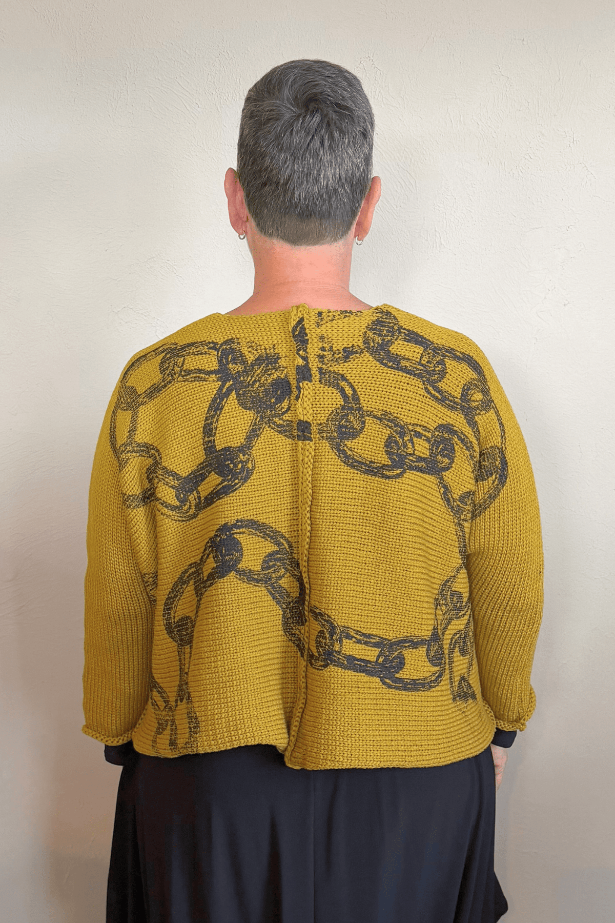 Paper Temples Heather Chain Pullover Sweater in mustard with charcoal chain print, front and back views