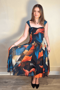 Delila Tea Length Paneled Dress