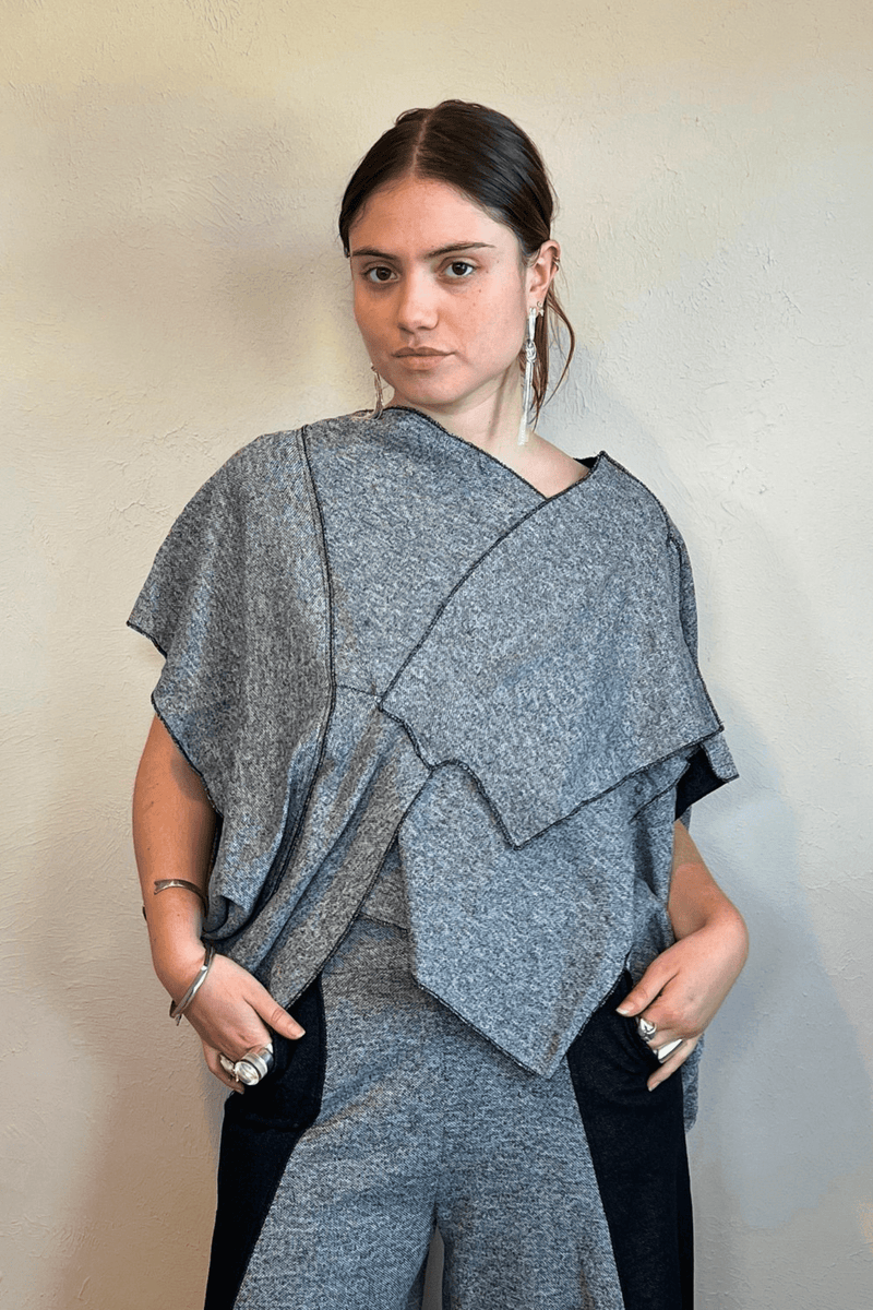 Model wearing the Kozan Fari draped top in heathered gray with black contrast edging, shown from front and back, including a full outfit view with coordinating pants.