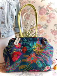 Atenti Floral Molly handbag with embroidered botanical design, chartreuse handles and trim, and organized lined interior